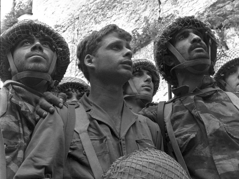 Israeli paratroopers stand in front of the Western Wall in Jerusalem